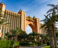 Luxury Tours Atlantis in the background of sky and palm trees