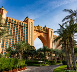 Luxury Tours Atlantis in the background of sky and palm trees