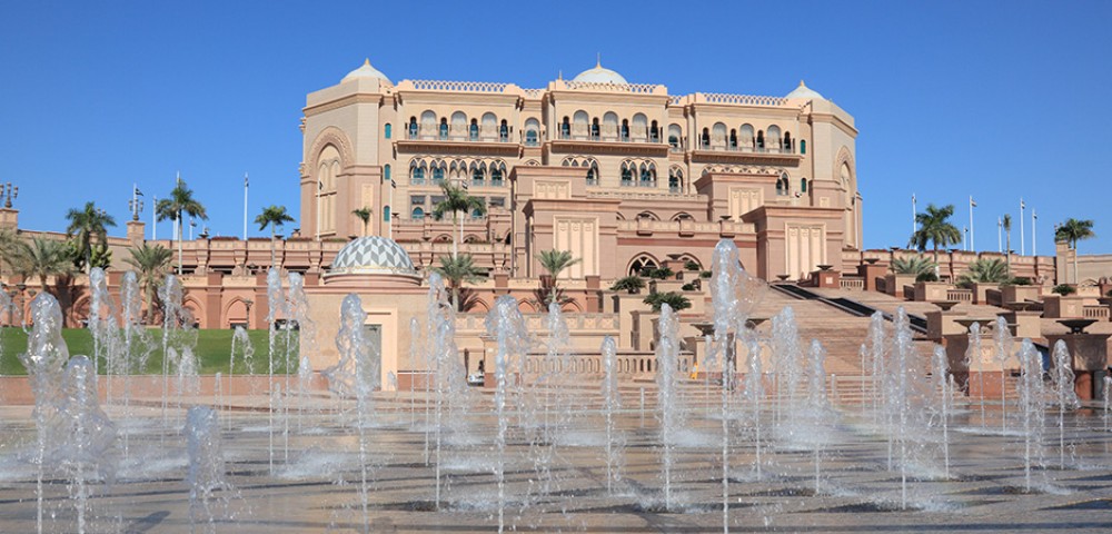 “A desert safari combo with a vehicle driving on the desert and Abu Dhabi City Tour combo  with tall buildings in the background”