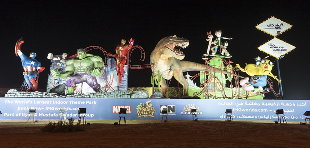 Dubai Sightseeing City Tour Combo Dubai Frame at day light and IMG Worlds of Adventure roaring dinosaur at night