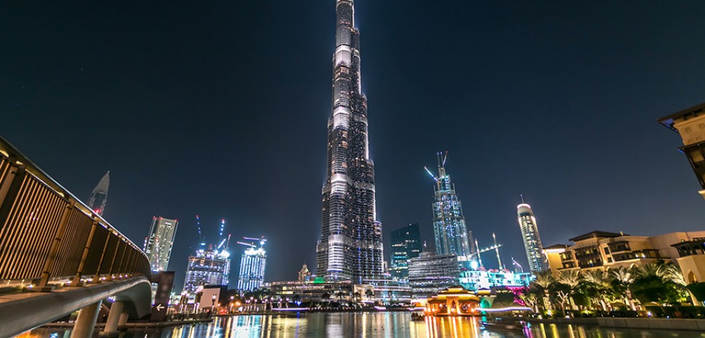 Dubai Sightseeing City Tour Combo well lit fountain and Burj Khalifa at night