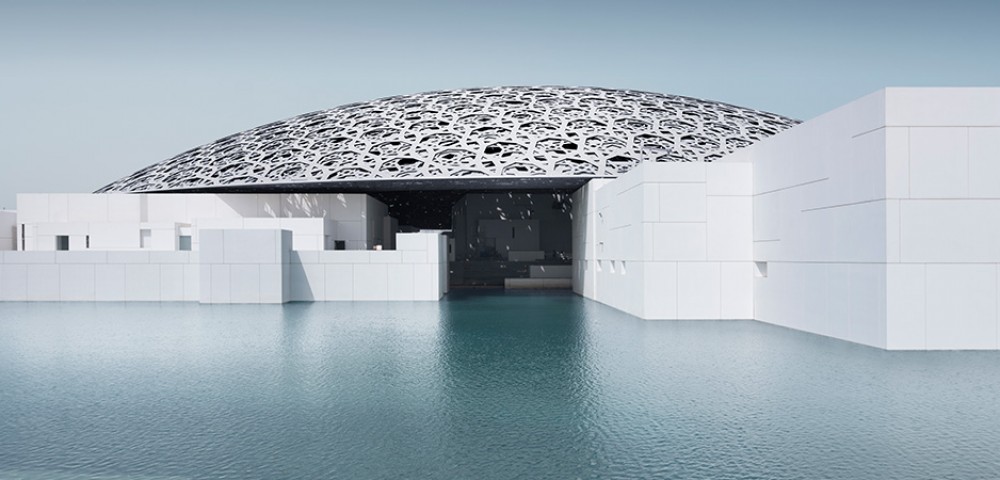 Abu Dhabi City Tour Combo beautiful skyline next to beach and group of people walking to Louvre Museum Abu Dhabi 