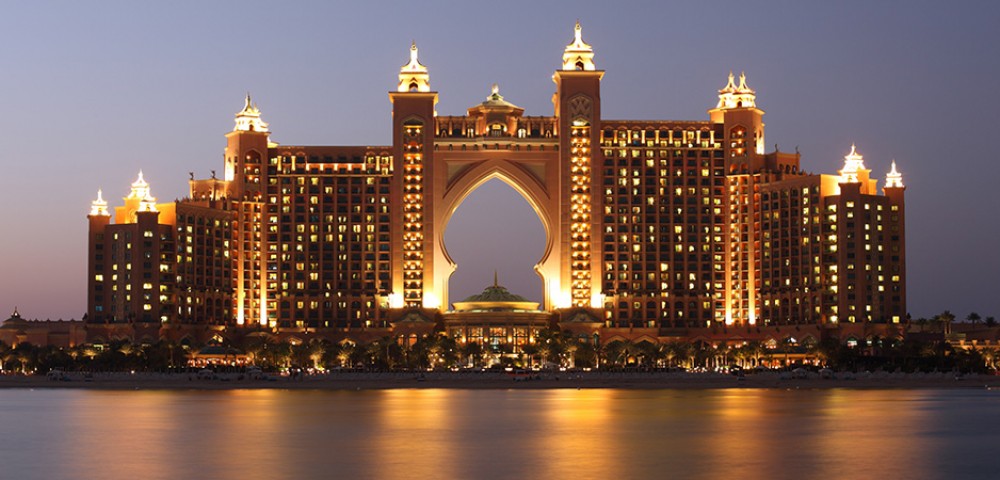 Luxury Tours Atlantis in the background of sky and palm trees