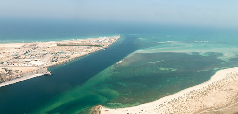 Ras Al Khaimah City Tour Combo Deals night view of tall buildings and mountains