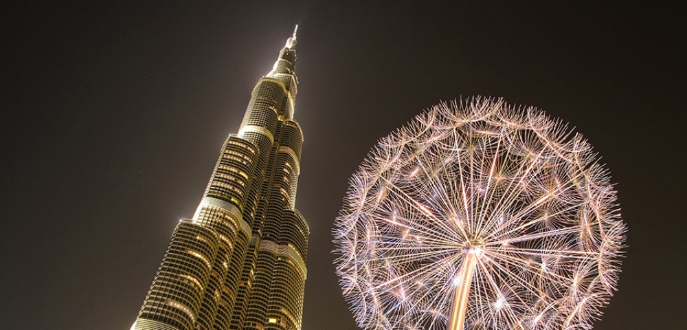 Dubai Sightseeing City Tour Combo well lit fountain and Burj Khalifa at night