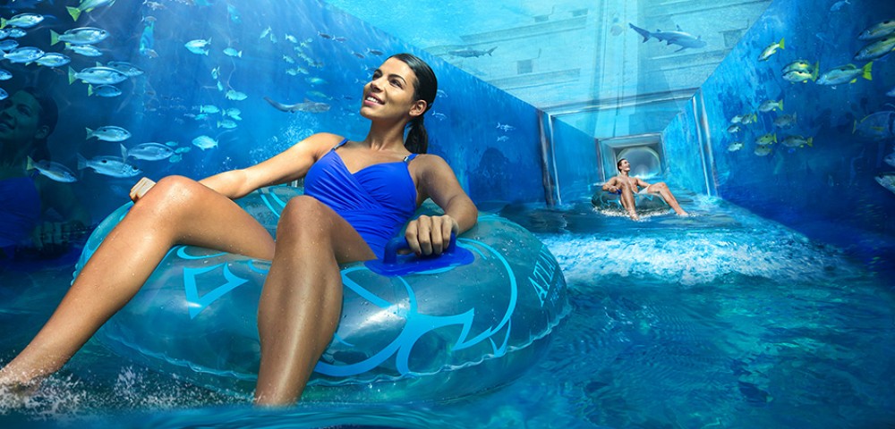 Theme Parks, Water Parks Combo Deals a girl at Aquaventure and a woman at Lost Chambers Aquarium