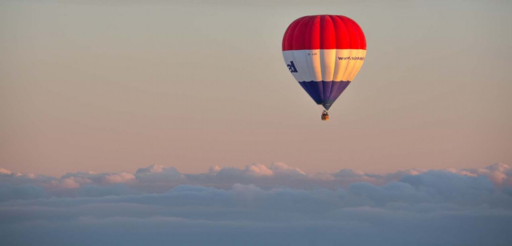 Hot Air Balloon Tourthrough amber sky