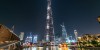 Dubai Sightseeing City Tour Combo well lit fountain and Burj Khalifa at night