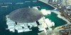 Abu Dhabi City Tour Combo beautiful skyline next to beach and group of people walking to Louvre Museum Abu Dhabi 