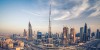 Dubai Sightseeing City Tour, a woman pointing to Burj Khalifa and Cruise Combo Deals Creek at night