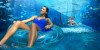 Theme Parks, Water Parks Combo Deals a girl at Aquaventure and a woman at Lost Chambers Aquarium