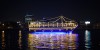 Dubai Sightseeing City Tour, a woman pointing to Burj Khalifa and Cruise Combo Deals Creek at night