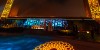 Dubai Sightseeing City Tour Combo Dubai Frame at day light and IMG Worlds of Adventure roaring dinosaur at night