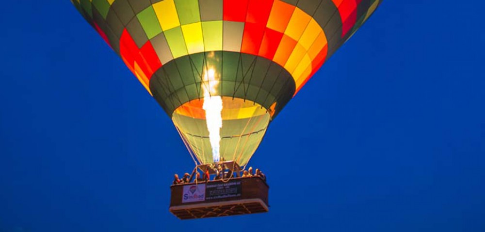 Hot Air Balloon Tourthrough amber sky