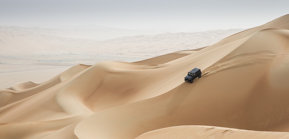 Liwa Desert Safari Tours black 4*4 vehicle dune bashing