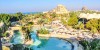Theme Parks, Water Parks Combo Deals, a person holding a falcon and Yas Water World long winded tunnel slides