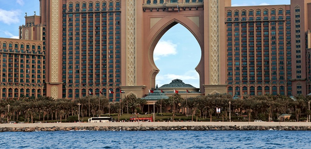 Luxury Tours Atlantis in the background of sky and palm trees